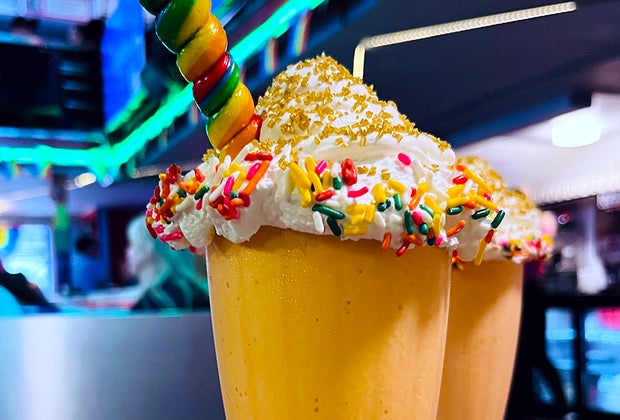 Pride-Themed Desserts in NYC : Ellen’s Stardust Diner Over the Rainbow Milkshake