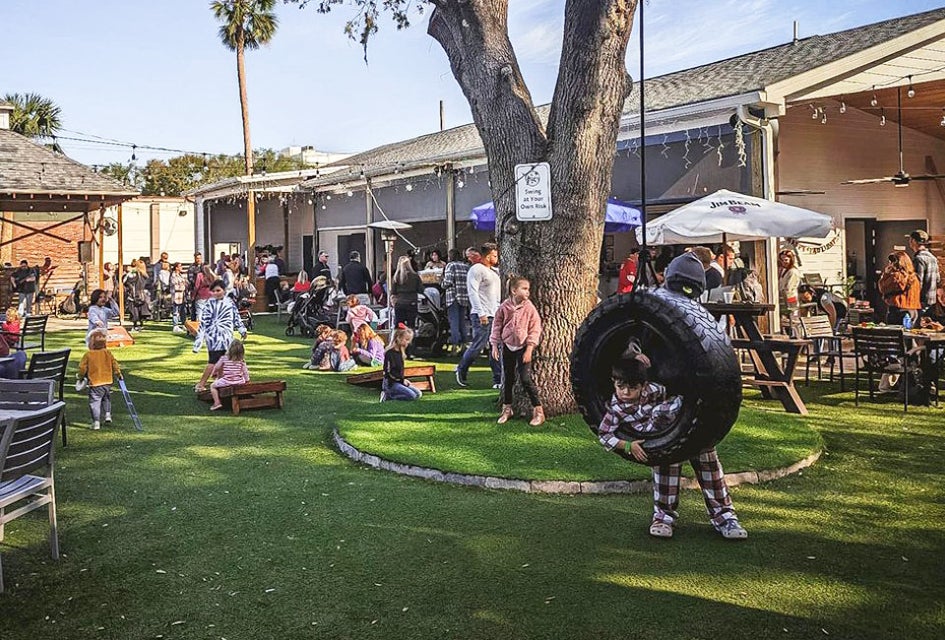 The Yardery offers a tire swing and yard games for the whole family to enjoy while parents savor a drink! Photo courtesy of the venue