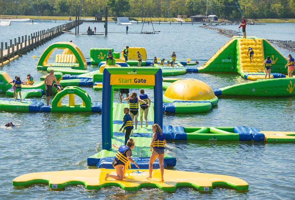 Hit the obstacle course at these inflatable Orlando water parks. Photo courtesy of The Orlando Watersports Complex