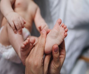 Infant massage can help with development. Photo by Polina Tankilevich via Pexels