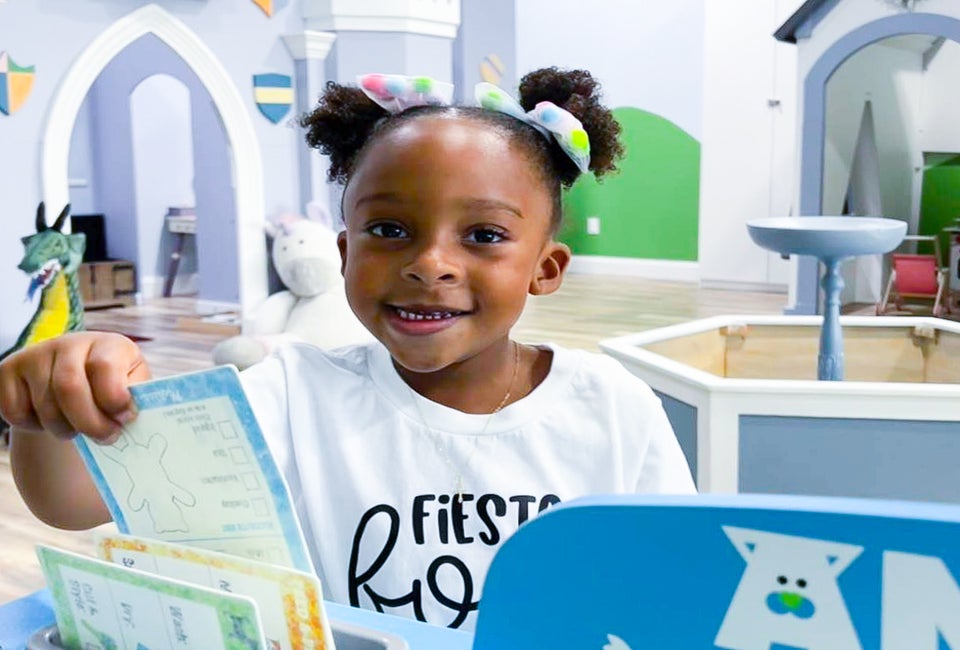 Little girl playing at an indoor play space in Houston. Photo courtesy of Frogs, Snails and Fairy Tales