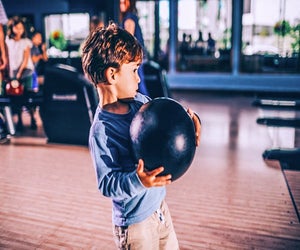 Little boy trying for a strike! Photo courtesy of Pinstripes