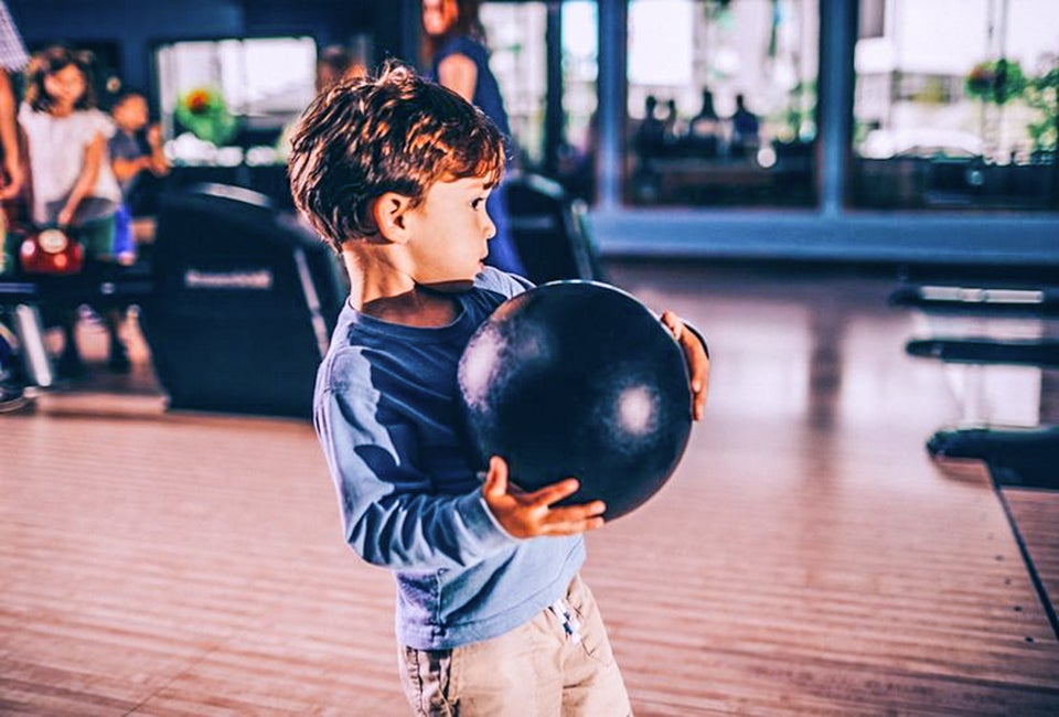Little boy trying for a strike! Photo courtesy of Pinstripes