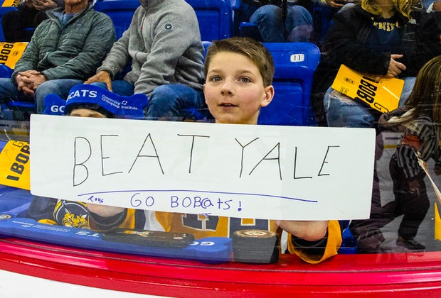 Photo of kids at ringside for Quinnipiac University hockey game.