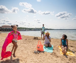Little girl running on the beach. Photo courtesy of Visit Lake Geneva 