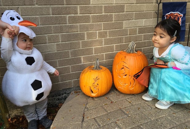 Olaf costume on the kid, Olaf face on the pumpkin!