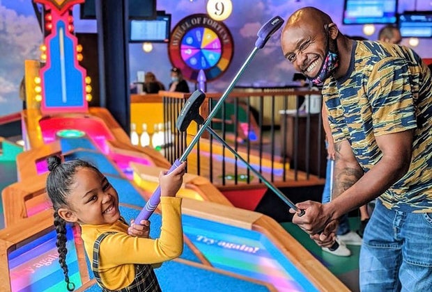 Photo of family playing mini golf - Best Fun Restaurants for Kids' Birthdays in Boston
