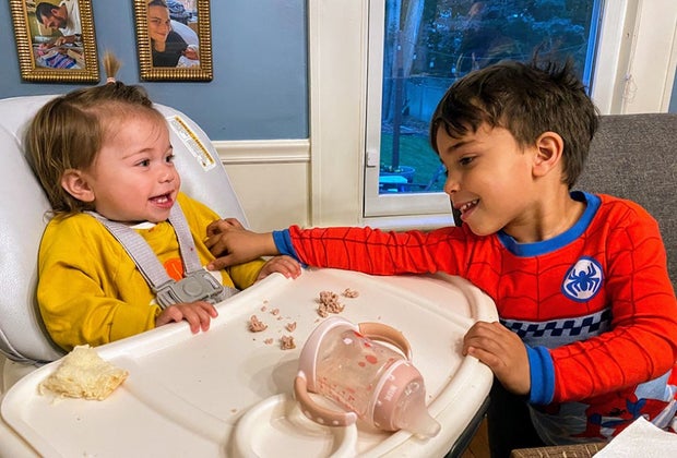 Child plays with younger sibling for Holidays & Activities for November 2024: Random Acts of Kindness