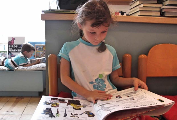 Little girl reading a book