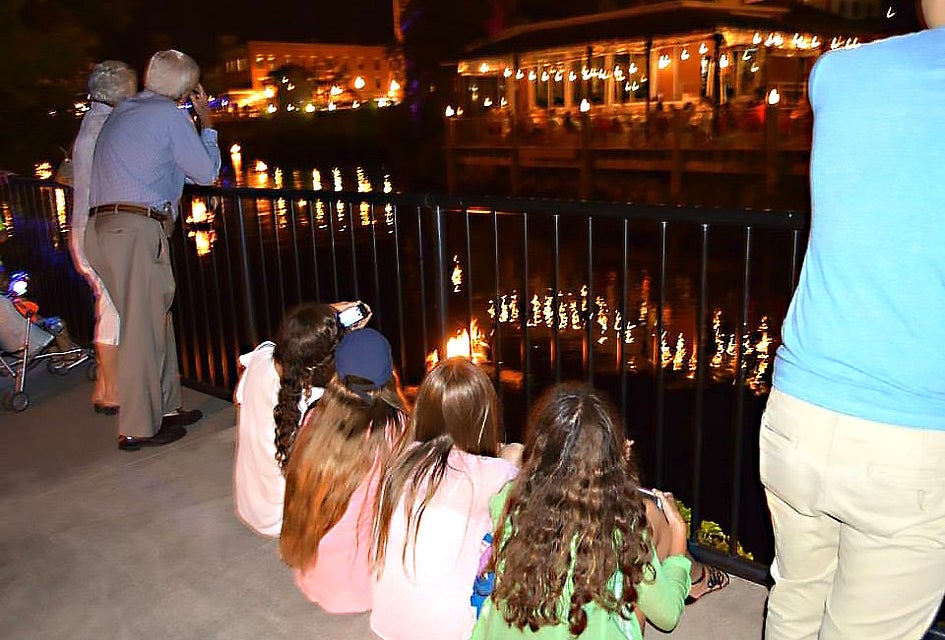 Kids settle in after fair activities to watch the River Glow. Photo courtesy of River Glow Pawcatuck