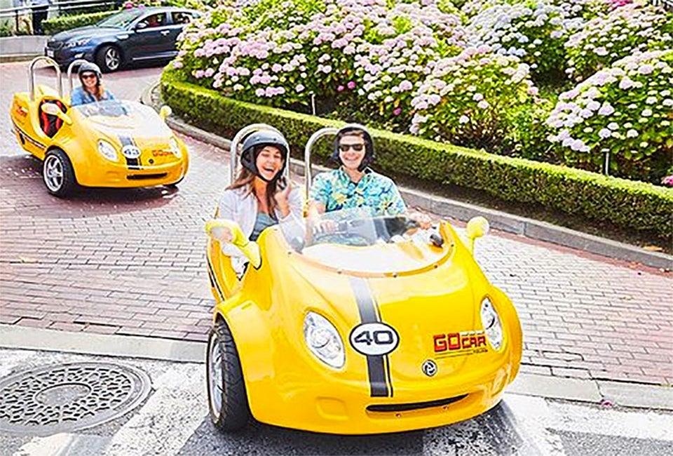 Travel through town in a tiny car with GoCar.