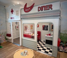 Schoolhouse Play & Cafe houses an enchanting play village for kids to explore. 