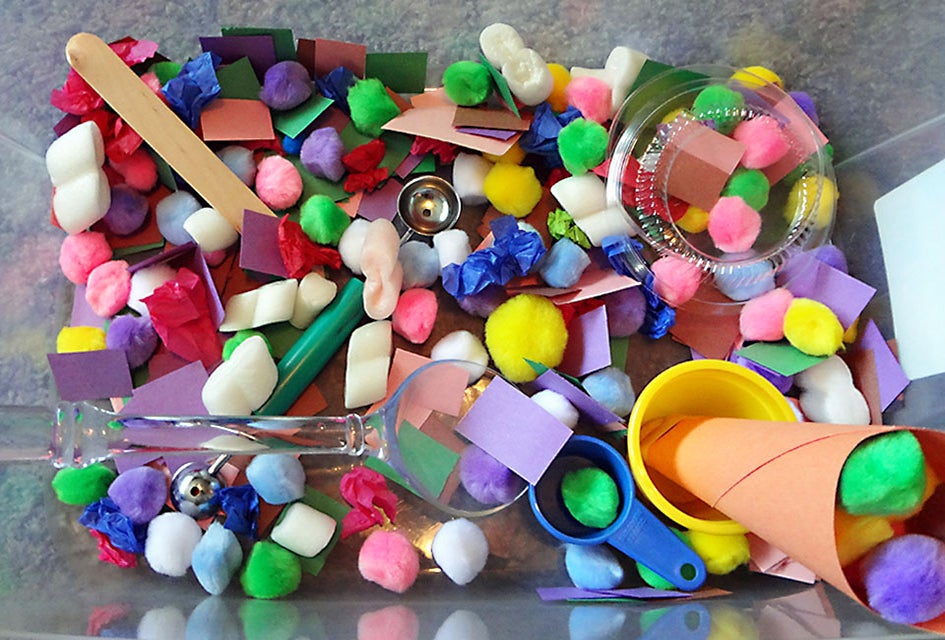 Create a colorful, texturized world with a DIY sensory bin. Photo by Emma Graig