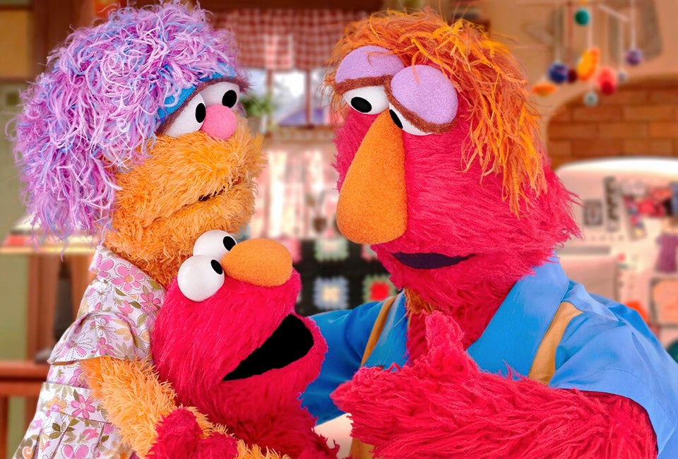 Elmo and his parents on Sesame Street. Image courtesy of PBS 