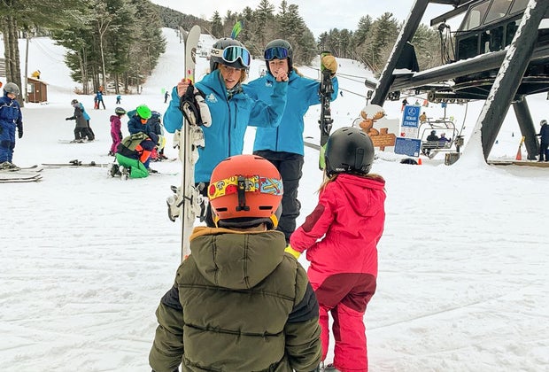 Photo of family near chair lift at a New England ski resort.