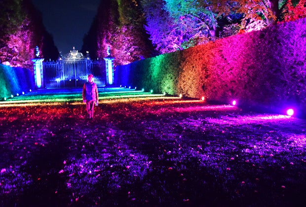 Boy in a rainbow-light filled lawn at Shimmering Solstice