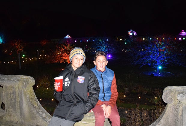 Boys sip on hot cocoa at Shimmering Solstice
