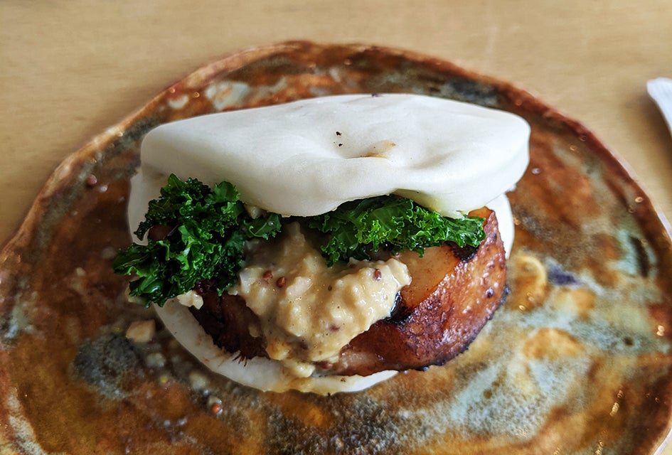 Shuya Cafe de Ramen's take on a classic bao bun features an extra-thick slice of glazed pork belly. 