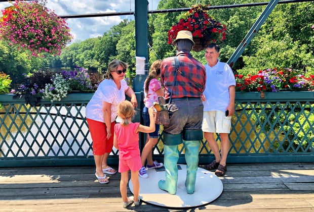 Image of family with sculpture - End of Summer Bucket List