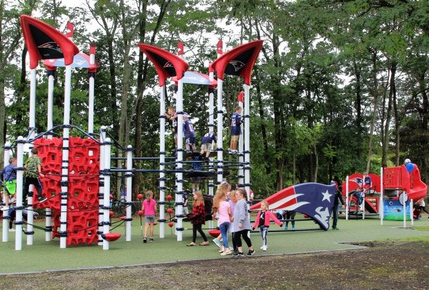 Little football fans get a kick out of playing at one of two Patriots-donated playgrounds south of the city. Photo courtesy of the New England Patriots
