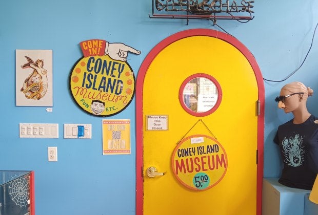 Head through the bright yellow door to see the treasures of the Coney Island Museum—as unique as the neighborhood it pays homage to!
