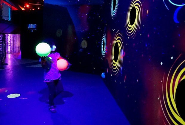 See how many black holes you can target with asteroids at Cosmic CAMP, a new intergalactic play space that's only here for a limited time.