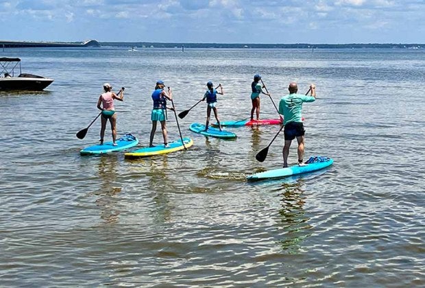 Paddleboarding  is just one of many fun water activities in Destin. Photo by Jennifer Swope