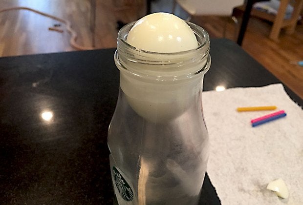 Watch as the egg slides into the bottle!