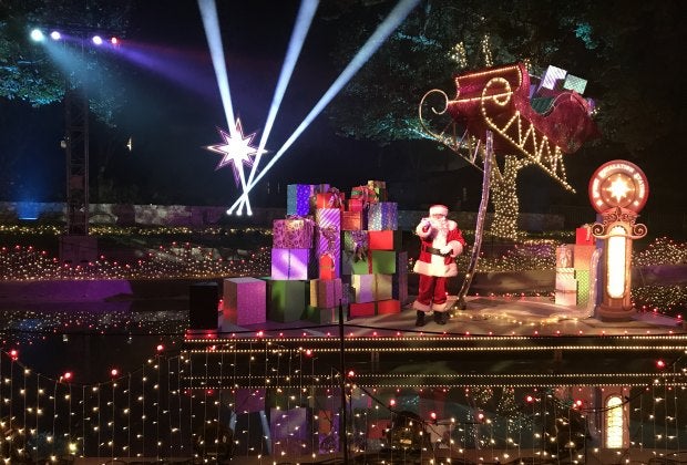 Santa Claus greets the trolley at Elf on the Shelf Magical Holiday Journey.