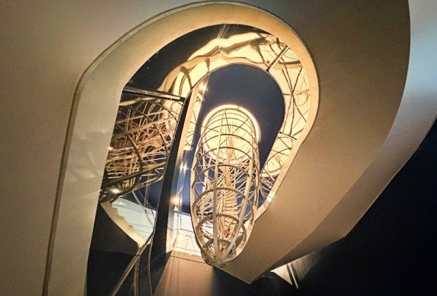 Math is all around you at MoMath, including on the spiral staircase that surrounds a parabola! 