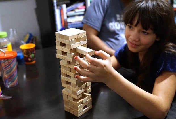 Pull out a block, place it on top but don't let the tower fall in the fun and challenging Jenga. Photo by Jody Mercier