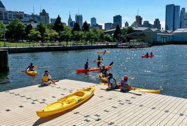 Kids can join parents for kayaking in NYC at Hudson River Park. Photo courtesy the Manhattan Community Boathouse