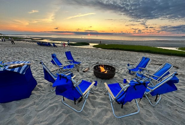 Enjoy s'mores at a fire pit on the private beach as the sun sets!