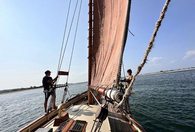 Take in the gorgeous views as you learn to hoist the sails.