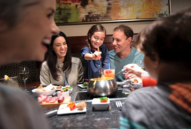 Families can gather around the fondue at the Melting Pot. 