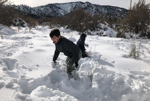 Visit Wrightwood and let your SoCal kids play in piles of pristine snow. Photo courtesy of Mommy Poppins