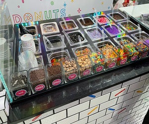 An epic toppings bar allows for an endless combination of sugar-filled treats at Sundae Donuts, Huntington's newest sweet shop. 