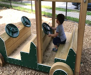 Little ones can take the wheel(s) of the wooden car at Sunset Park.