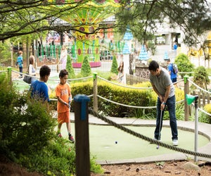 Enjoy some quality family time at the Castle Fun Center's mini-golf course.