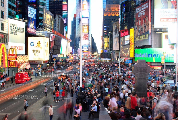 Night time view of Times Square one of our favorite tourist attractions in NYC