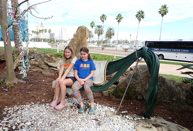 Best Things To Do in St. Petersburg, Florida: Dali Museum two girls pose with Dali art