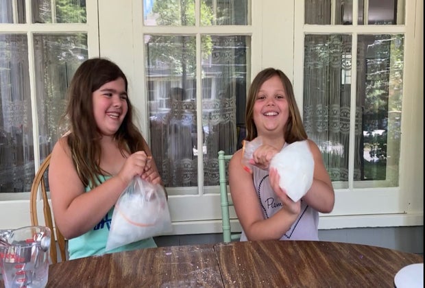 Two girls shake their ice cream in a bag!