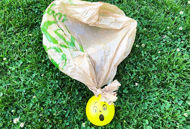 a picture of a water balloon parachute, one of the must fun outdoor science activities for kids.