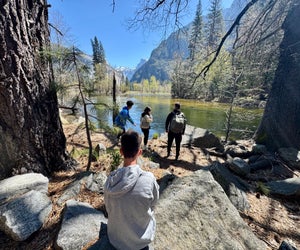 Take a break along the Merced River as you hike along the Valley Loop Trail in Yosemite National Park. 